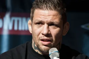 M M A Fighter Speakingat Press Conference Wallpaper