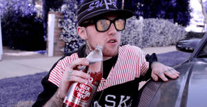 Mac Miller Holding Bottle Wallpaper