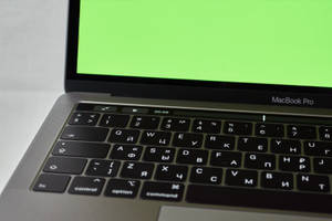 Macbook On A Green Screen Wallpaper