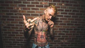 Machine Gun Kelly In Brick Wall Wallpaper