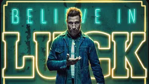 Mad Sweeney From American Gods Against A Dramatic Background Wallpaper