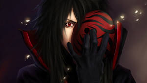 Madara Uchiha And His Fearsome Sharingan Wallpaper