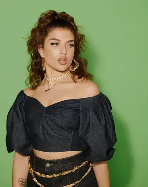 Mae Muller Glowing In The Spotlight Wallpaper