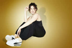 Mae Muller Performing On Stage In A Denim Jacket Wallpaper