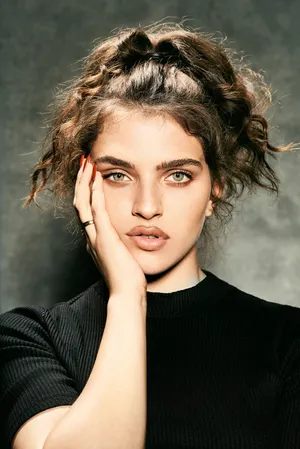 Mae Muller Striking A Pose For A Photoshoot Wallpaper