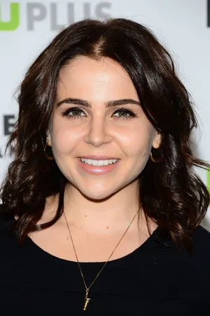 Mae Whitman Posing Confidently In A Stylish Outfit Wallpaper