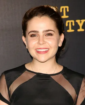 Mae Whitman Striking A Pose In A Chic Outfit Wallpaper
