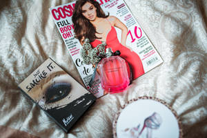 Magazine With Bottle Of Perfume Wallpaper