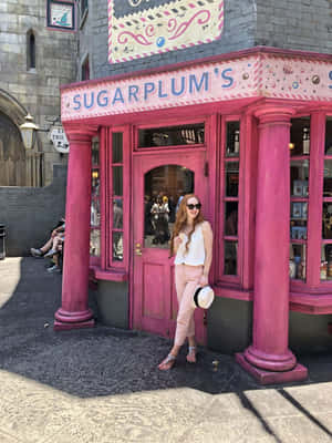 Magical Diagon Alley Bustling With Curious Witches And Wizards Wallpaper