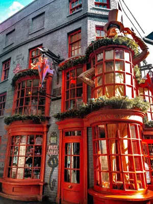 Magical Diagon Alley Bustling With Witches And Wizards Wallpaper