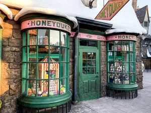 Magical Diagon Alley Bustling With Wizards And Witches Wallpaper