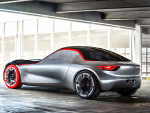 Magnificent Opel Gt Gliding On Asphalt Wallpaper