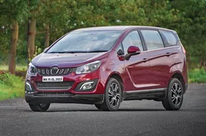Mahindra Marazzo Red Model On Road Wallpaper