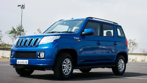 Mahindra T U V300 Blue S U V Side View Wallpaper