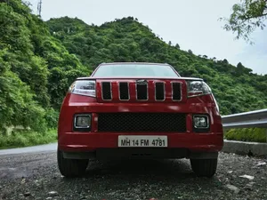 Mahindra T U V300 Front View Mountain Backdrop Wallpaper