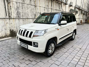Mahindra T U V300 Parked Outdoors Wallpaper