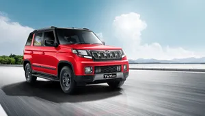 Mahindra T U V300 Red Model On The Move Wallpaper