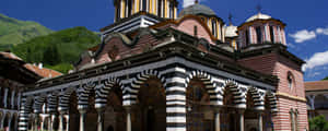 Majestic Arches Of Rila Monastery Wallpaper