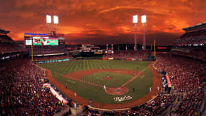 Majestic Baseball Stadium Under A Vibrant Sky Wallpaper