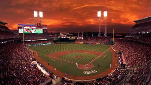 Majestic Baseball Stadium Under A Vibrant Sky Wallpaper