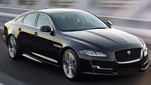 Majestic Beauty Of Jaguar Xj In Full Display Wallpaper