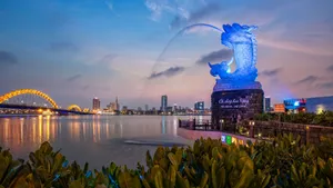 Majestic Blue Dragon Perched On A Rock Wallpaper