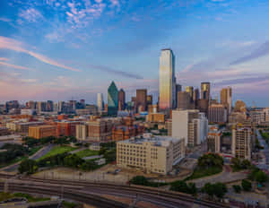 Majestic Dallas Skyline At Nighttime Wallpaper