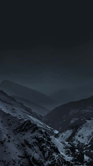 Majestic Dark Mountain Against Starry Sky Wallpaper