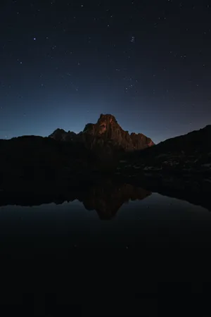Majestic Dark Mountain At Night Wallpaper