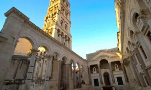 Majestic Diocletian's Palace Against A Vibrant Blue Sky Wallpaper