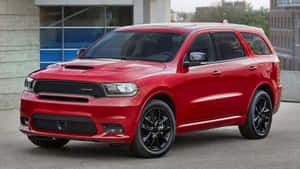 Majestic Dodge Durango Cruising On A Tranquil Countryside. Wallpaper