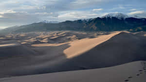 Majestic Elegance Of Desert Sand Dunes Wallpaper