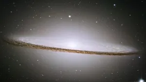 Majestic Elliptical Galaxy In Night Sky Wallpaper