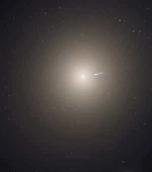 Majestic Elliptical Galaxy In The Cosmos Wallpaper