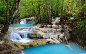 Majestic Erawan Waterfall In Thailand Wallpaper