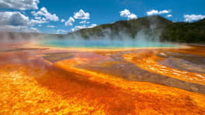 Majestic Eruption Of A Geyser In Yellowstone National Park Wallpaper