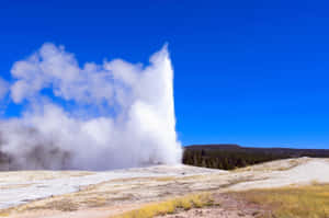 Majestic Eruption Of Yellowstone Geysers Wallpaper