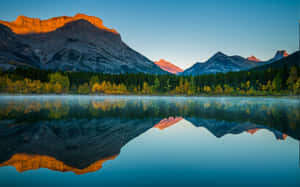 Majestic Fall Lake Under The Clear Blue Sky Wallpaper