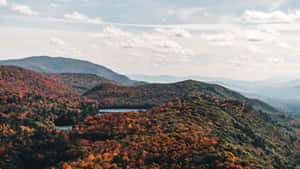 Majestic Fall Mountains In Vibrant Autumn Colors Wallpaper