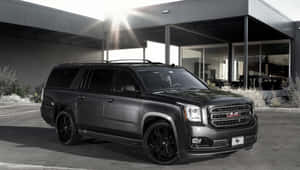 Majestic Gmc Yukon Cruising On The Open Road Wallpaper
