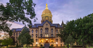 Majestic Golden Dome Of The University Of Notre Dame Wallpaper