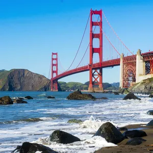 Majestic Golden Gate Bridge Overlooking The Rocky Bay Wallpaper