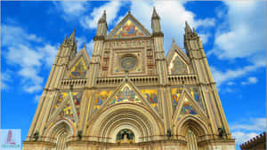 Majestic Gothic Architecture Of A Medieval Church With Intricate Detailing Wallpaper