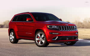 Majestic Grand Cherokee Off-roading In Natural Terrain Wallpaper