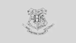 Majestic Hogwarts Crest On A Magical Background Wallpaper