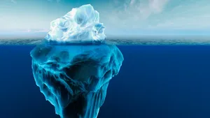 Majestic Iceberg Floating In The Cold Ocean Wallpaper