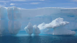 Majestic Iceberg In Crystal Clear Waters Wallpaper