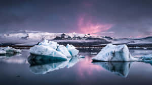 Majestic Iceberg On A Calm Sea Wallpaper