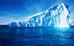 Majestic Iceberg On A Frozen Ocean Wallpaper