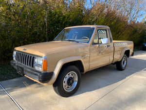 Majestic Jeep Comanche Conquering The Off-road Terrain Wallpaper